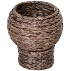 Round braided cat bed on a braided pedestal with a beige cushion