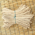 Bundle of flat braided natural rattan craft cord