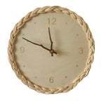 Round wall clock with a braided rattan rim and beige dial