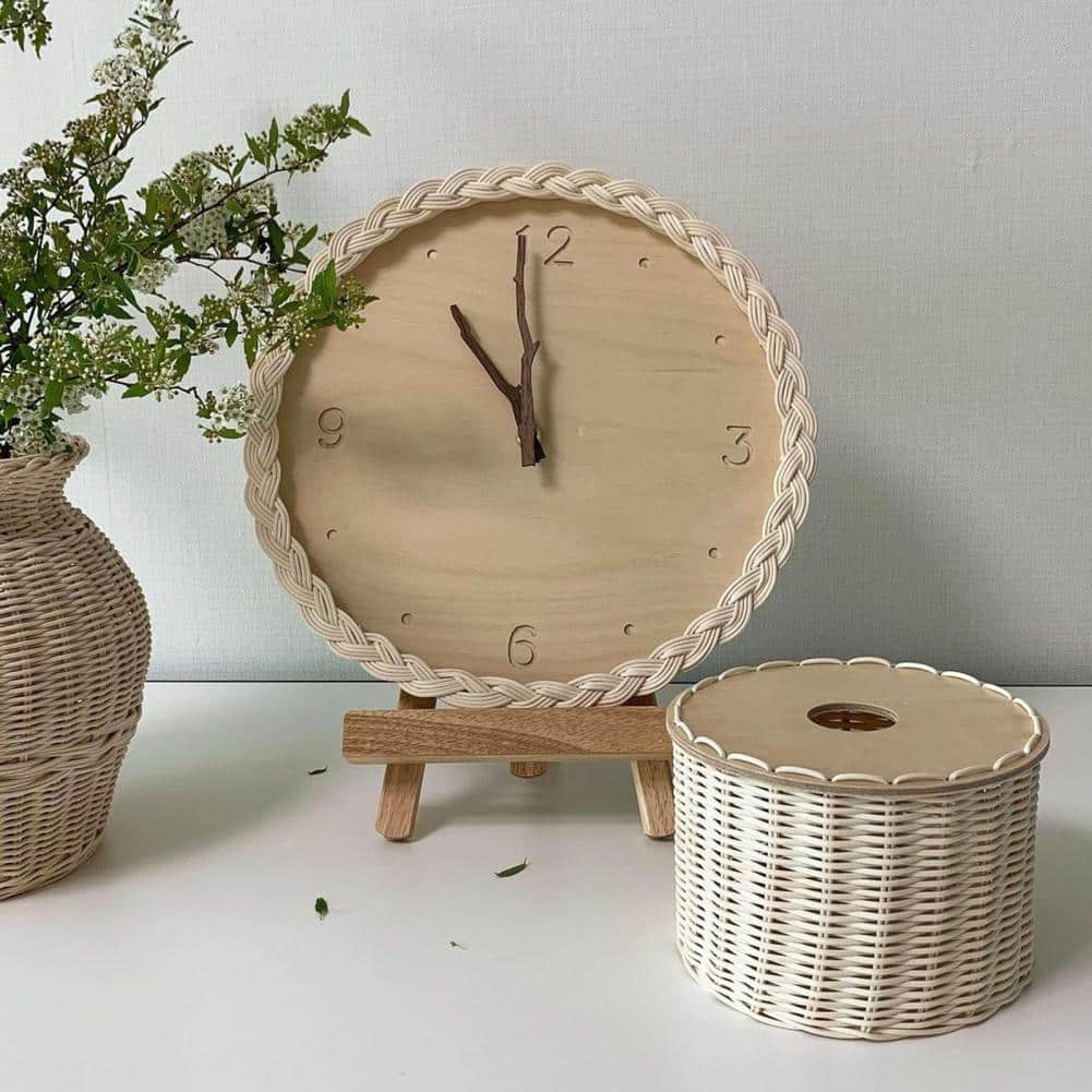 Round wall clock with a braided rattan rim and beige dial