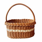 Oval wicker basket with braided rim and arched handle