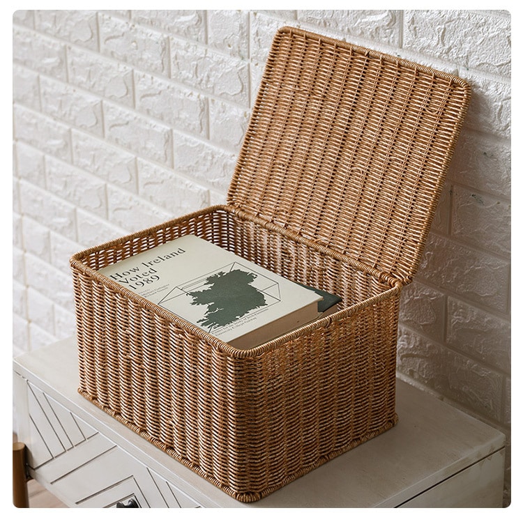 Stacked brown lidded woven storage boxes