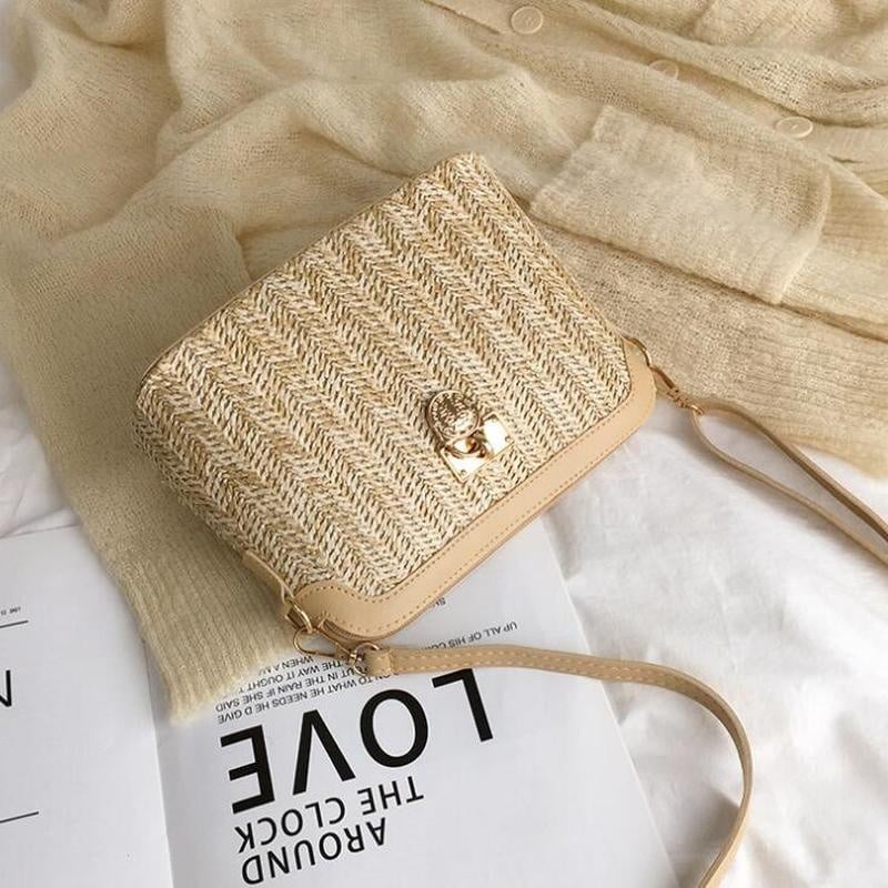 Rounded brown woven basket bag with a gold chain strap