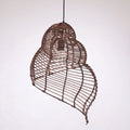 Brown open weave rattan pendant shaped like a conch seashell