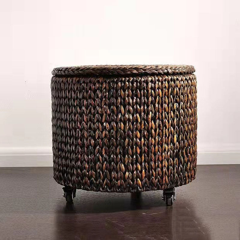 Brown hand woven rattan footstool on casters with a lift off lid