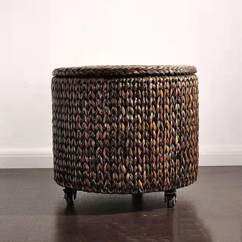 Brown hand woven rattan footstool on casters with a lift off lid
