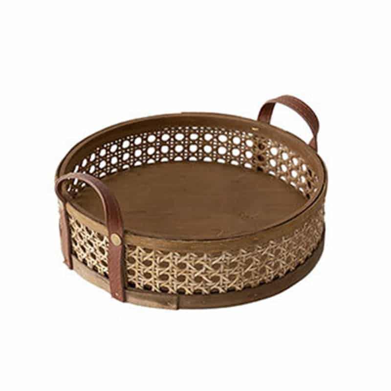 Round brown rattan storage tray with stitched leather handles