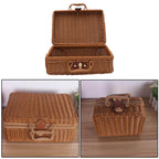 Small brown woven rattan box shaped like a retro suitcase with straps