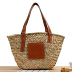 Brown hand woven raffia straw handbag with two sturdy handles