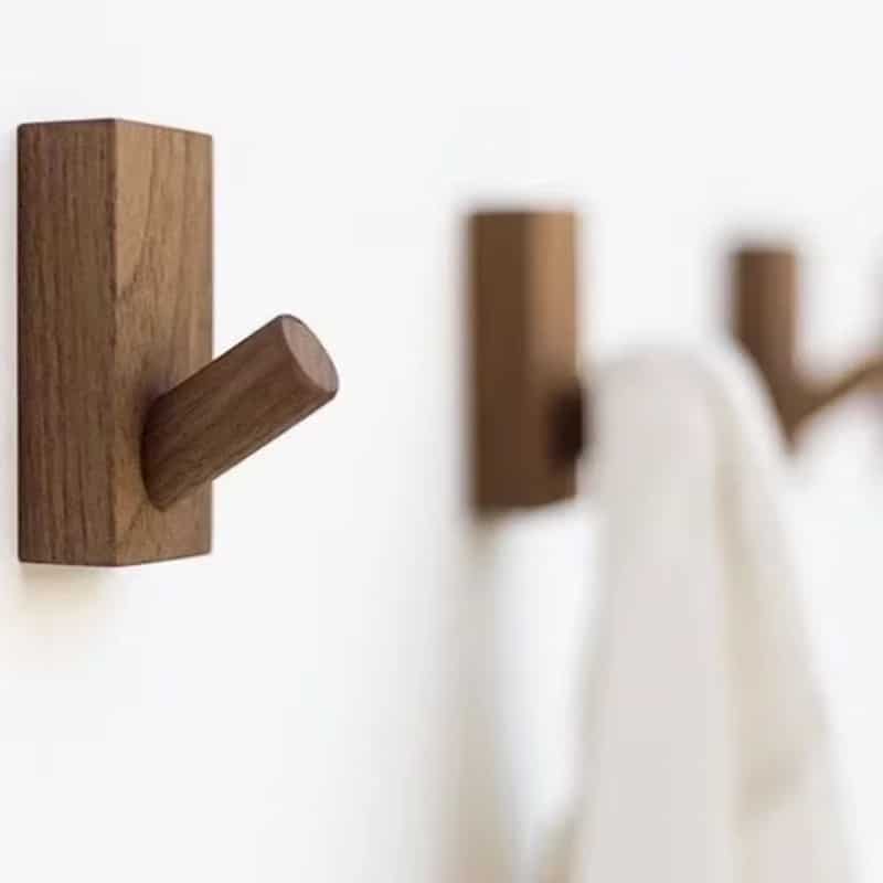 Small brown wood wall hook with visible grain