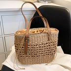 Caramel brown woven straw beach handbag with a braided cord strap
