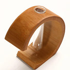 C shaped bamboo stand holding a clear glass test tube