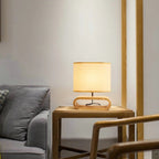 Chic rounded bedside lamp with a brown wood base and yellow fabric shade