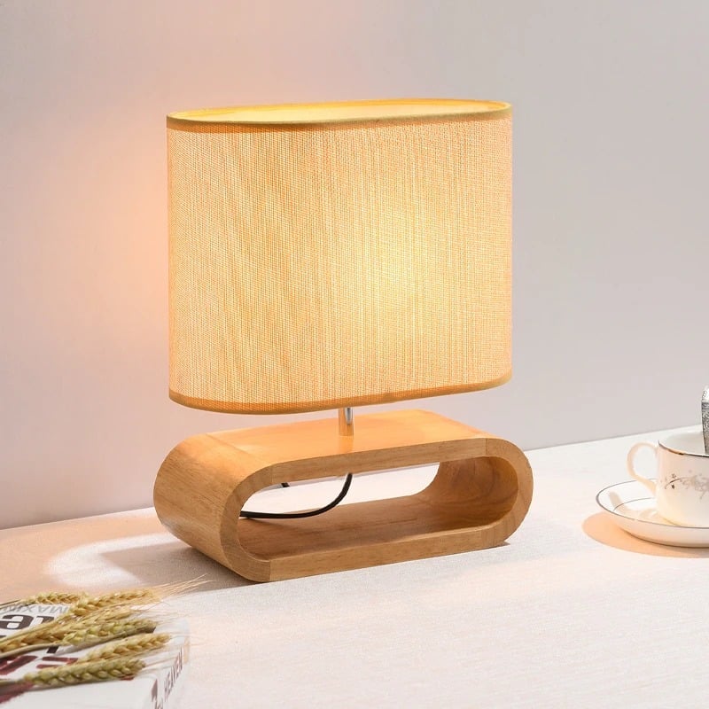 Chic rounded bedside lamp with a brown wood base and yellow fabric shade