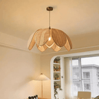Chinese style pendant light with hand woven rattan petals flaring around an iron frame