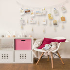 Colorful fabric bunting and a macrame photo display with clips