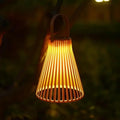 Colorful rattan look solar lantern in orange or green aluminum