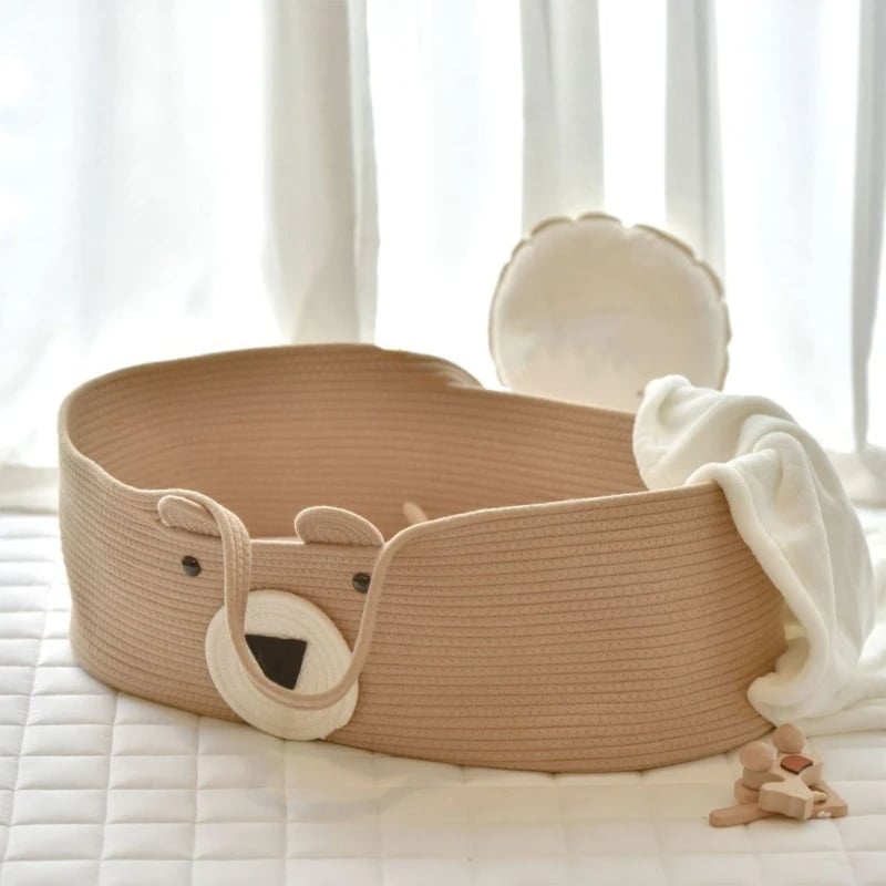 Brown cotton rope changing basket with a bear face and handles