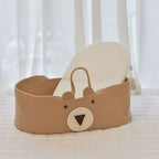 Brown cotton rope changing basket with a bear face and handles
