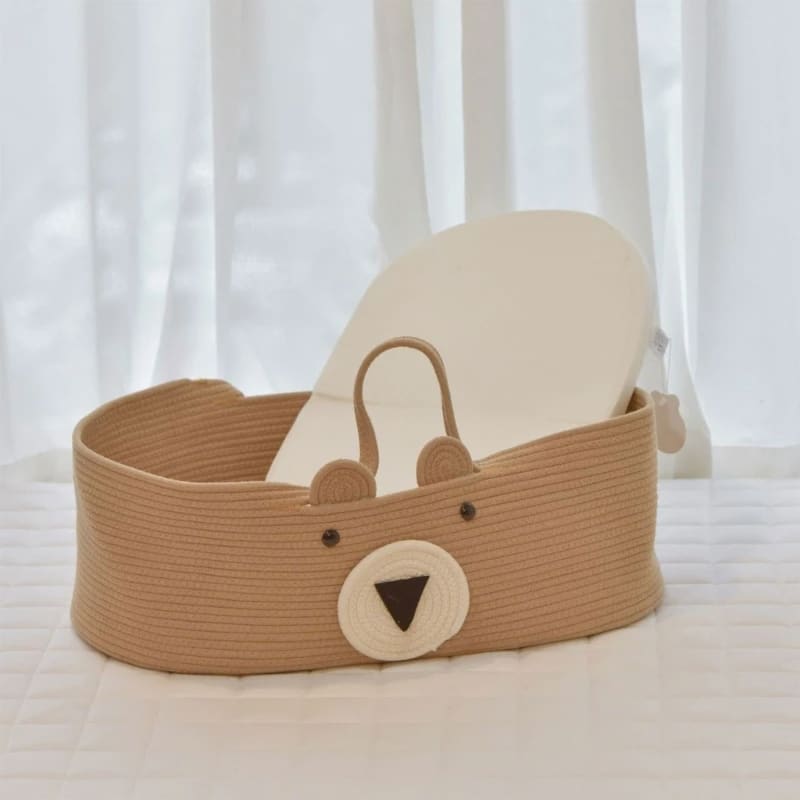 Brown cotton rope changing basket with a bear face and handles