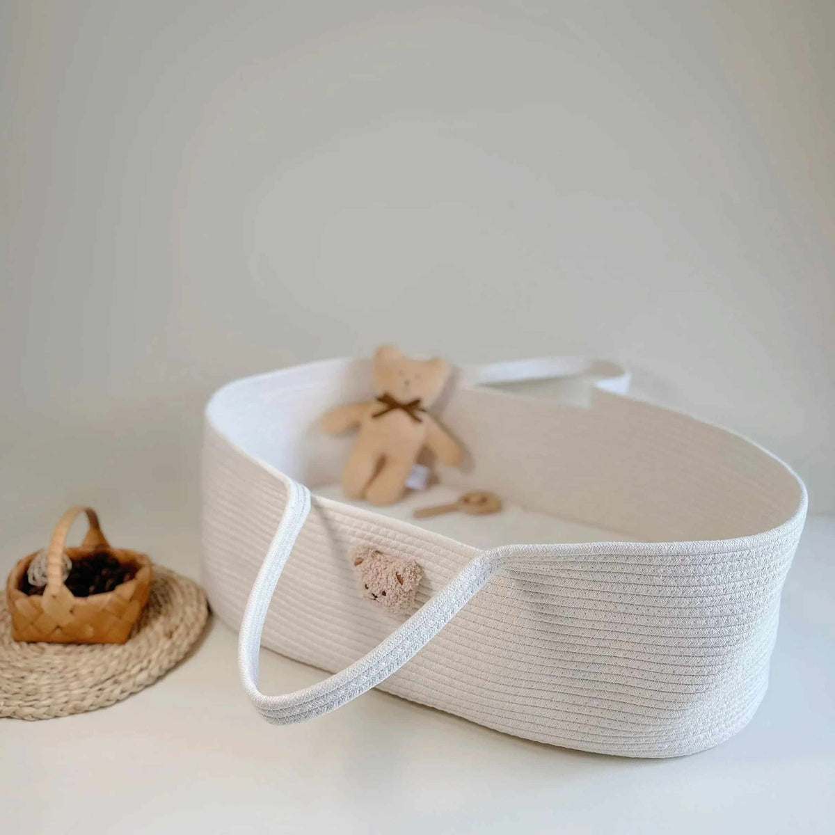 Gray cotton rope changing basket with a bear face and handles