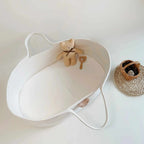 Gray cotton rope changing basket with a bear face and handles