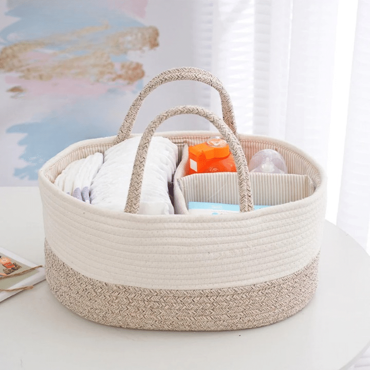 Cotton rope diaper caddy with dividers holding diapers and wipes