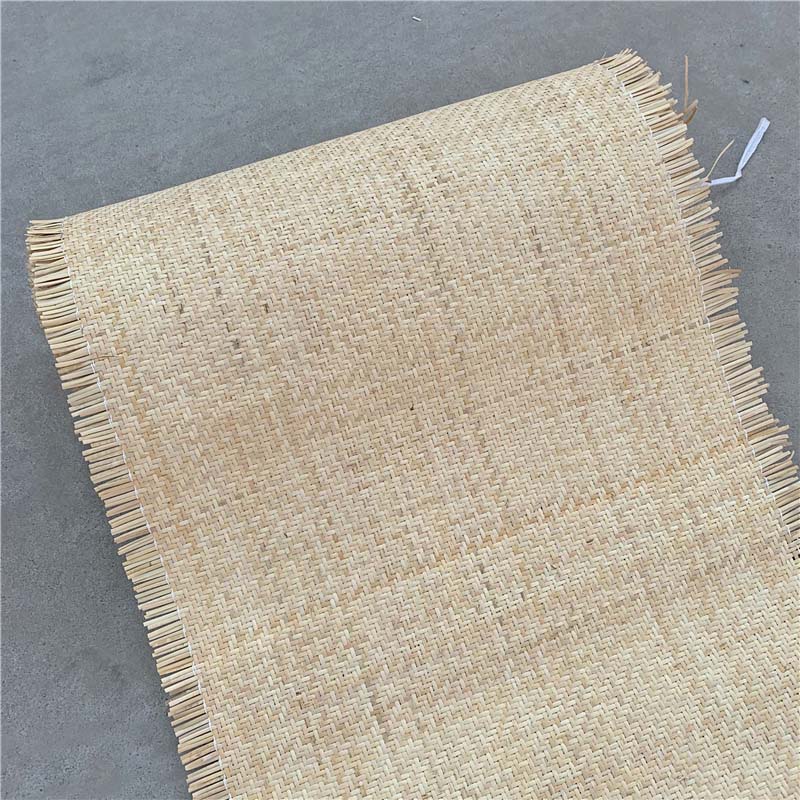 Sheet of natural rattan cane webbing with a crosshatch weave