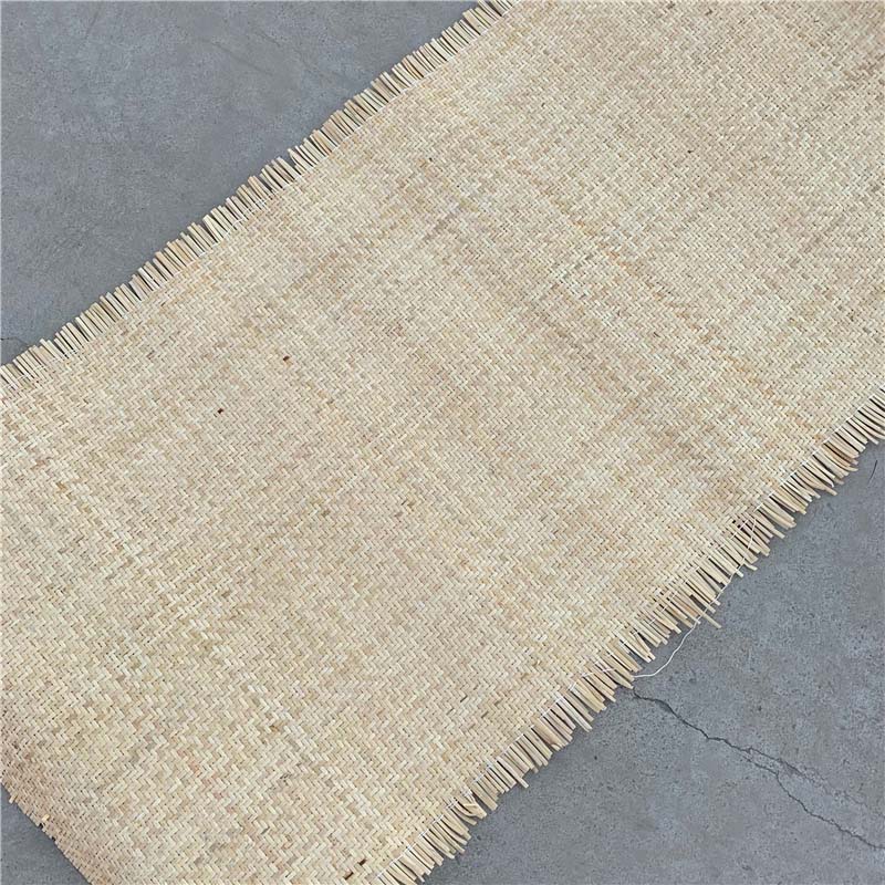 Sheet of natural rattan cane webbing with a crosshatch weave