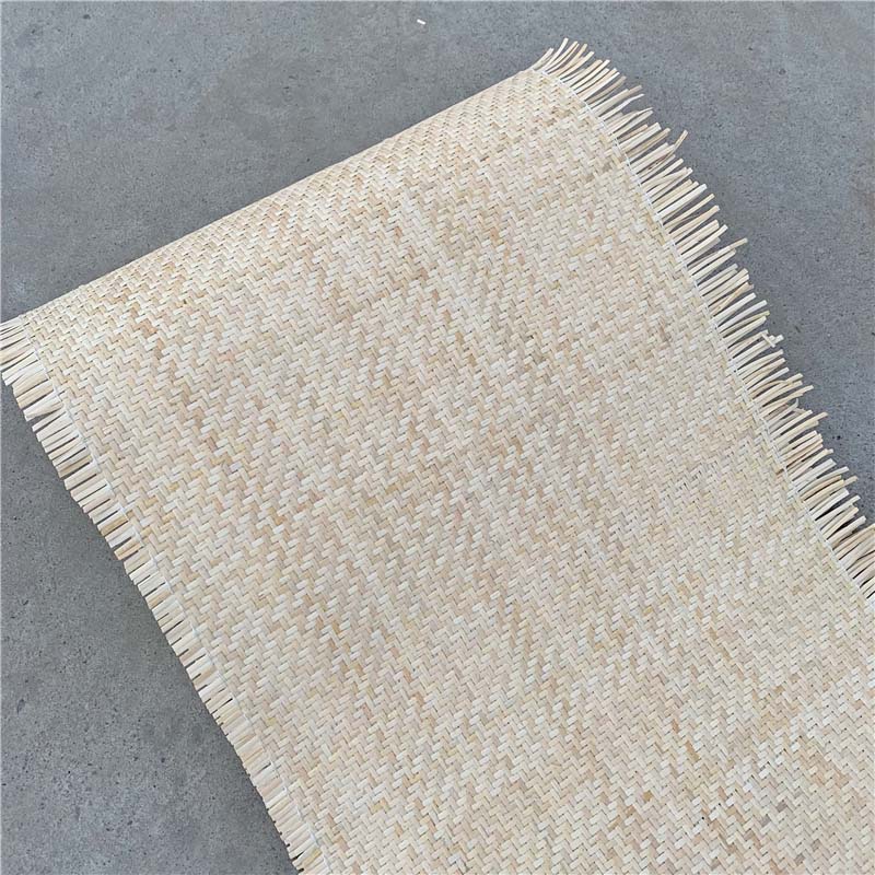 Sheet of natural rattan cane webbing with a crosshatch weave