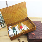 Low flat storage box hand woven in dark natural rattan with a lid