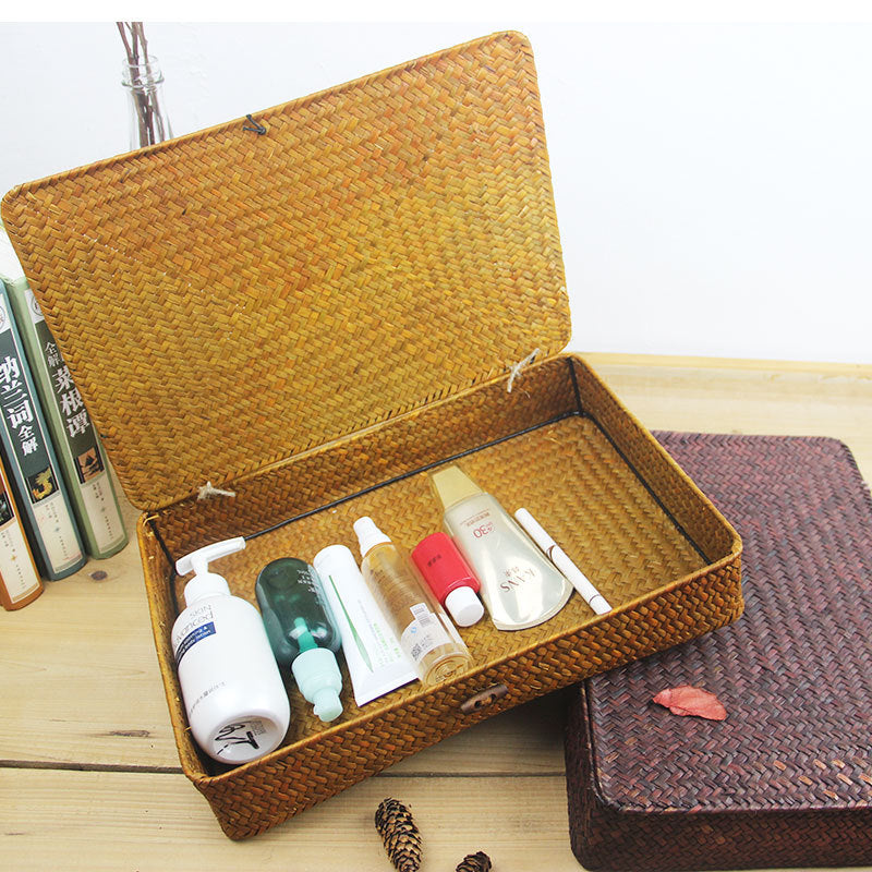 Low flat storage box hand woven in dark natural rattan with a lid