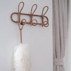 Round hand woven dark rattan wall hook with three hooks