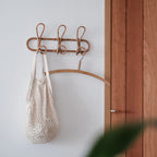 Round hand woven dark rattan wall hook with three hooks