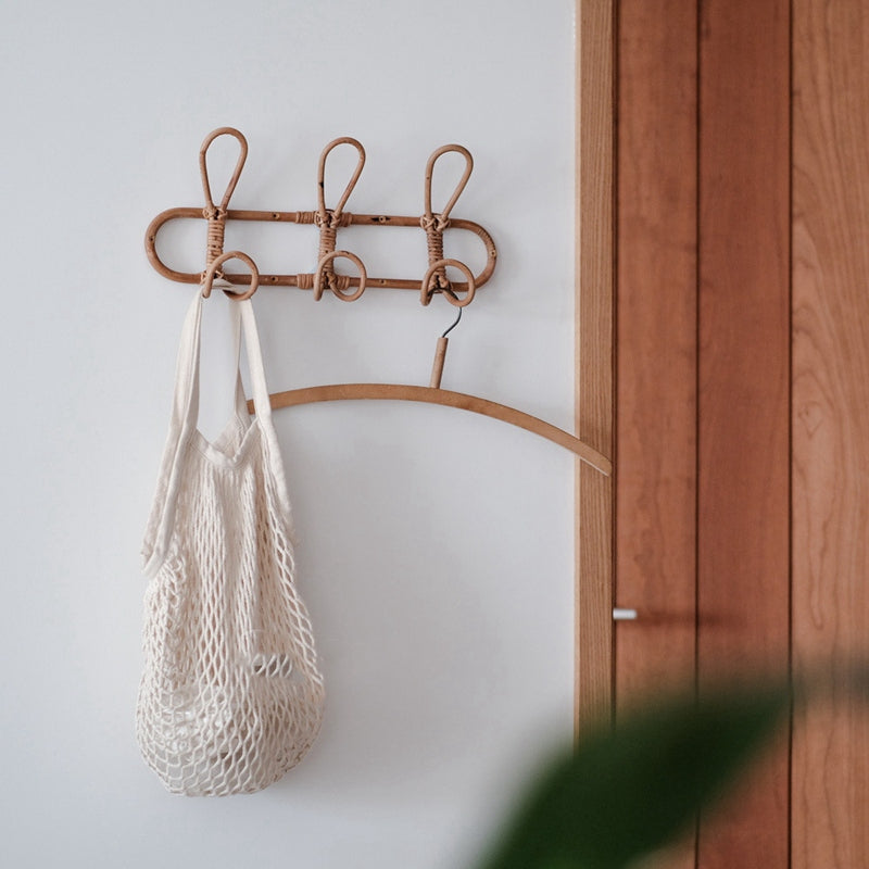 Round hand woven dark rattan wall hook with three hooks