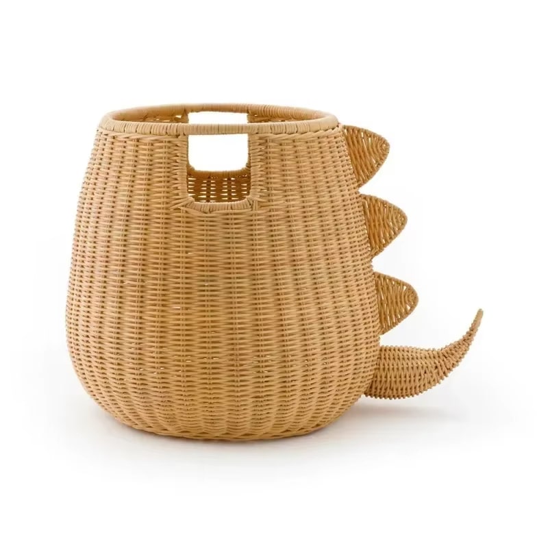 Rattan storage basket shaped like a dinosaur with woven spikes and tail