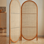 Two panel room divider with rounded oval tops in hand woven natural rattan