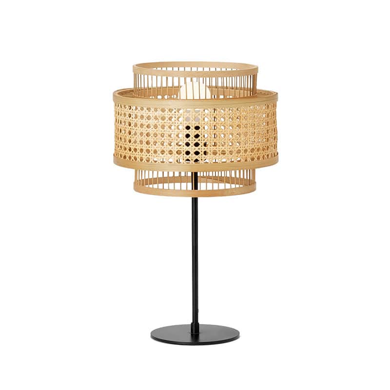 Sculptural floor lamp with two round hand woven rattan shades stacked on a bamboo frame