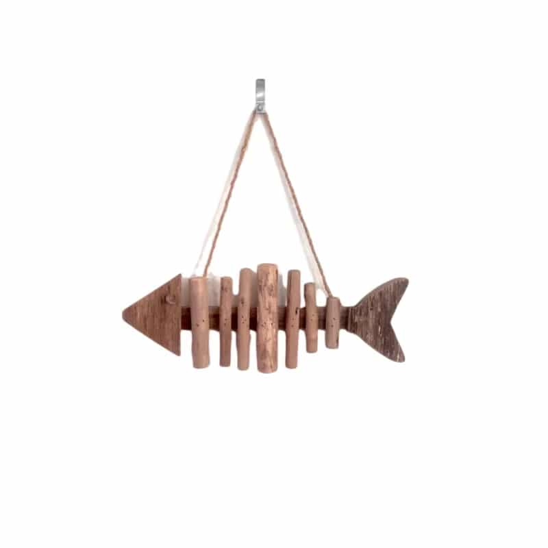 Fish shaped wall ornament made of driftwood pieces on a hanging cord