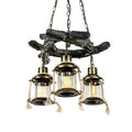 Long industrial pendant light with a gray driftwood look resin beam and iron fittings