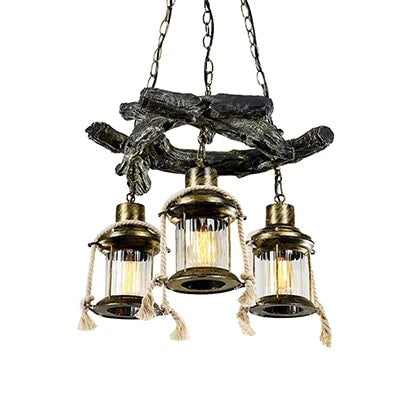 Long industrial pendant light with a gray driftwood look resin beam and iron fittings