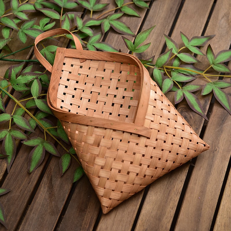Envelope shaped woven wood chip wall basket with strap