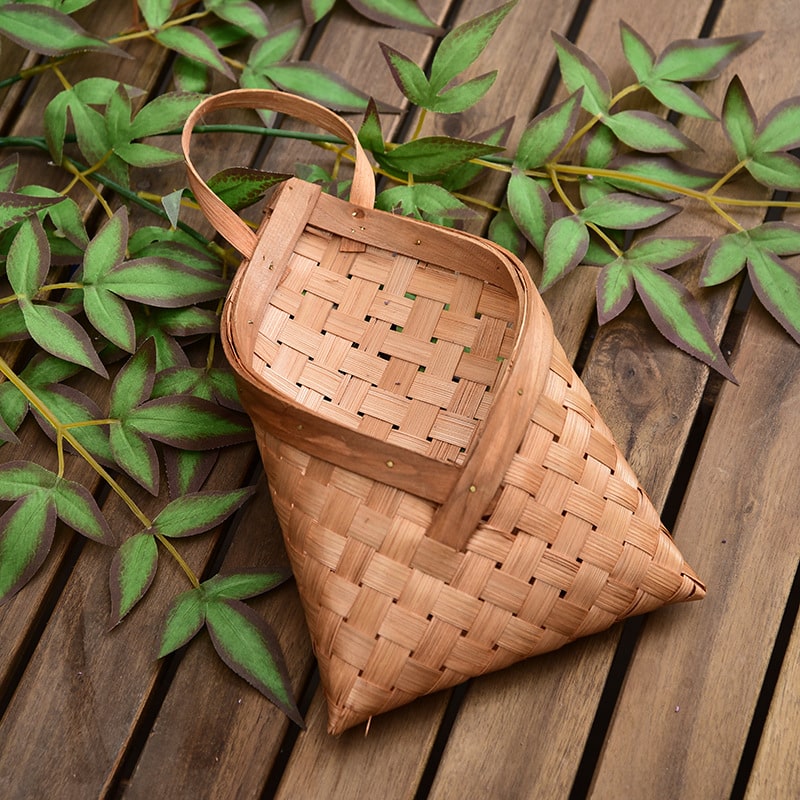 Envelope shaped woven wood chip wall basket with strap