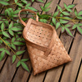 Envelope shaped woven wood chip wall basket with strap