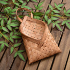 Envelope shaped woven wood chip wall basket with strap