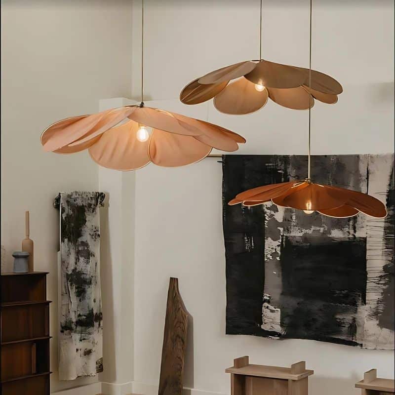 Large flower shaped fabric petal pendant light over a bed