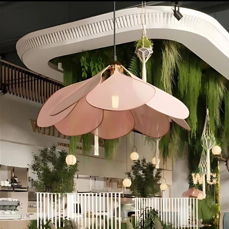 Large flower shaped fabric petal pendant light over a bed