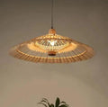 Large fan shaped wall sconce hand woven in natural rattan