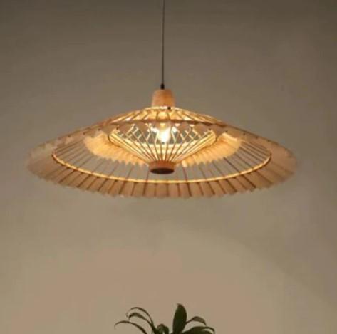 Large fan shaped wall sconce hand woven in natural rattan