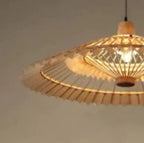 Large fan shaped wall sconce hand woven in natural rattan